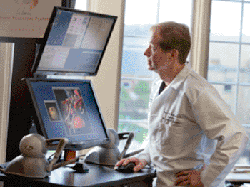 Image: Dr. Warren Selman and the Selman Surgical Rehearsal Platform (Photo courtesy of Surgical Theater).